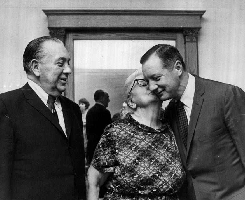 Mayor Richard J. Daley (left) oversees as the newly elected 11th Ward Ald.  Michael A. Bilandic receiving a kiss from his mother in 1969. Bilandic himself would serve as mayor, becoming the fourth mayor of Chicago of the 11th Ward.