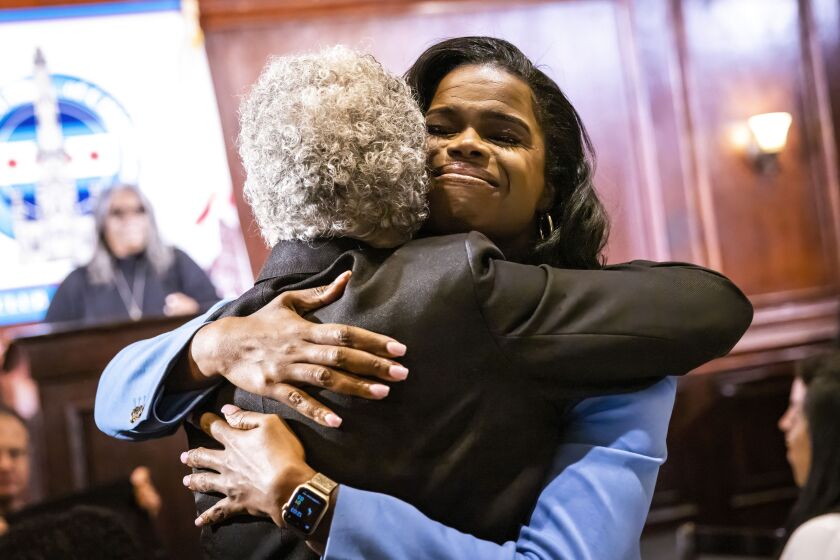Cook County State Attorney Kim Foxx hugged Cook County Council President Toni Preckwinkle before speaking Tuesday at the City Club of Chicago.