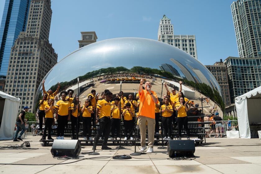 Rev.  Michael Pfleger delivers a short sermon as Sam Williams and St.  Sabina Youth Choir of Chicago performing during the Chicago Gospel Music Festival at Millennium Park in the Loop, Saturday, June 3, 2023. |  Pat Nabong/Sun-Times